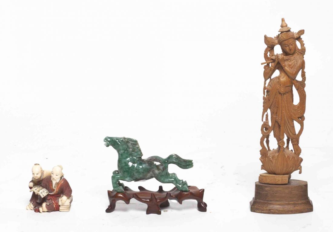 A Group of Asian Decorative Articles, Height of tallest: A Group of Asian Decorative Articles, comprising a polychrome decorated Japanese marine ivory okimono, a hardstone figure of a horse and an Indonesian carved wood deity. Height of tallest 8 1/4 inches