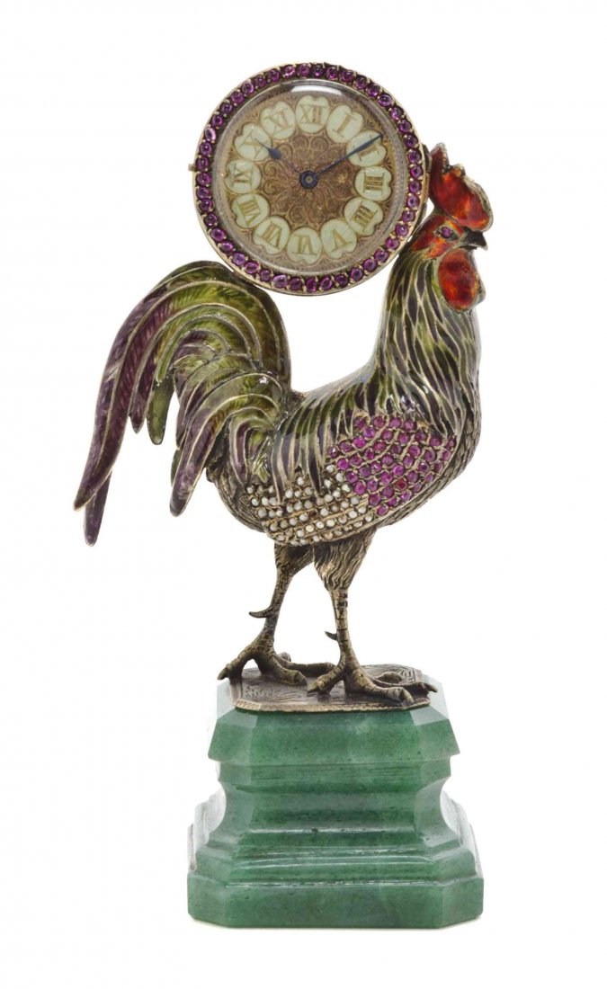 An Enameled and Jeweled Figural Clock, Height 5 1/2: An Enameled and Jeweled Figural Clock, the circular clock with Roman numerals and mounted on a rooster's back, the whole set on an onyx base. Height 5 1/2 inches. Property from the Estate of Edsel and