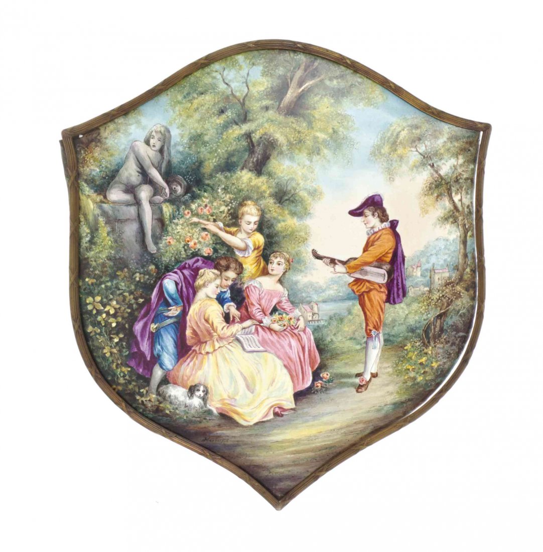 A French Enamel on Copper Plaque, Height 9 3/8 x width: A French Enamel on Copper Plaque, of shield form, decorated to show figures and a dog within a garden, signed indistinctly. Height 9 3/8 x width 8 3/8 inches. Property from the Estate of Edsel and Dol