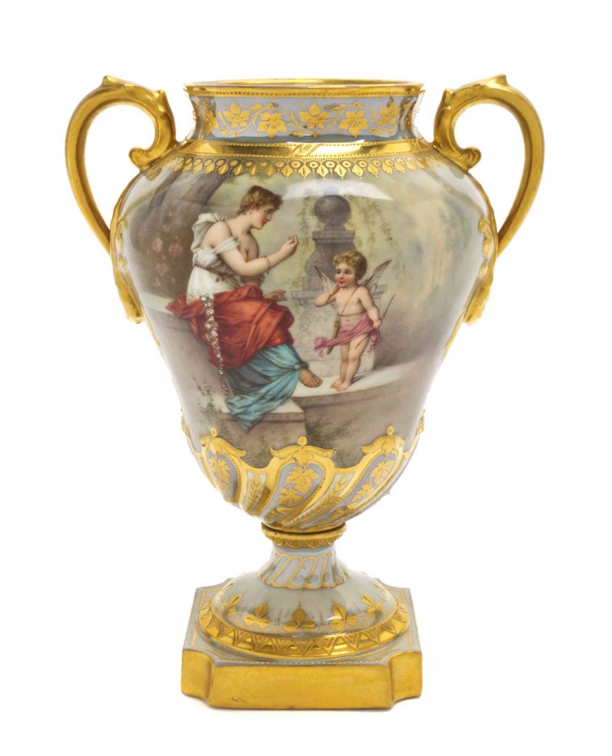 A Royal Vienna Porcelain Vase, Height 8 1/4 inches.: A Royal Vienna Porcelain Vase, of baluster form, mounted at the shoulders with gilt handles, decorated with a woman and Cupid in a landscape. Height 8 1/4 inches. Property from the Estate of Edsel and