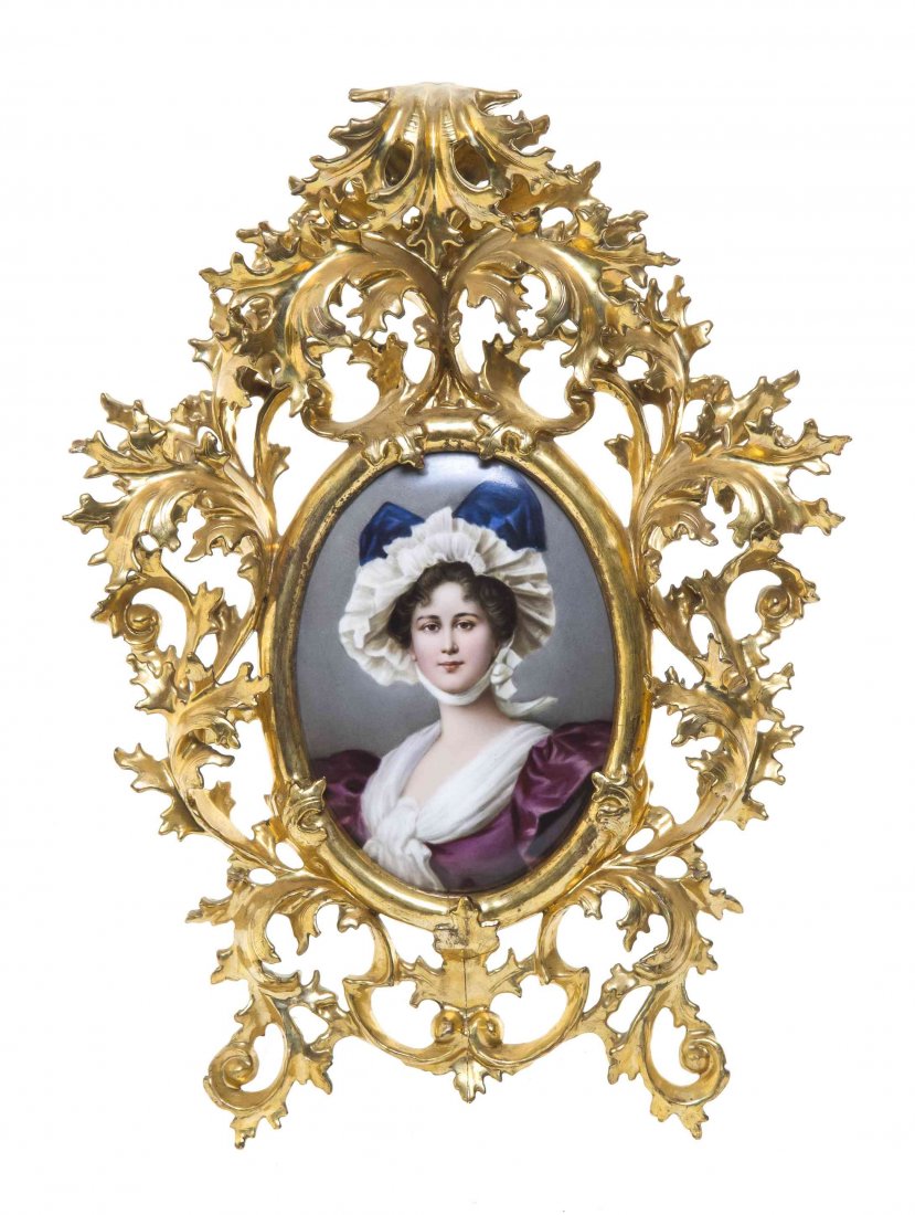 A Berlin (K.P.M.) Porcelain Plaque, Height 6 1/2 x: A Berlin (K.P.M.) Porcelain Plaque, of oval form, depicting a maiden in a white bonnet with a blue ribbon, bearing impressed marks, set in a Rococo giltwood frame. Height 6 1/2 x width 4 5/8 inches. P