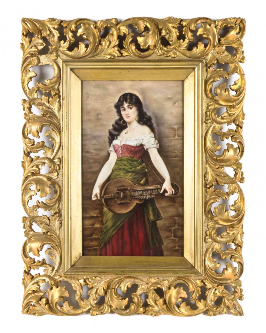 A Berlin (K.P.M.) Porcelain Plaque, Height 12 5/8 x: A Berlin (K.P.M.) Porcelain Plaque, depicting a gypsy girl holding a hurdy gurdy, signed A.L. Henderson and dated May 1895, set in a foliate carved giltwood frame. Height 12 5/8 x width 7 1/4 inches.