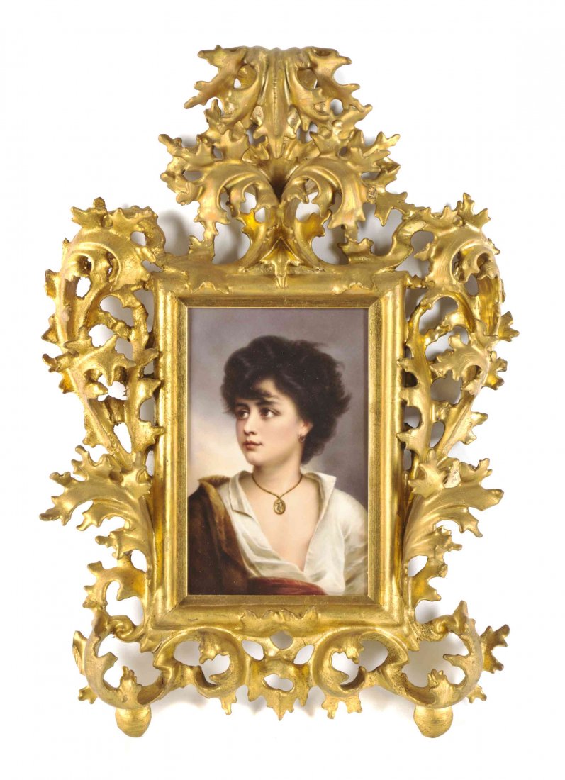 A Berlin (K.P.M.) Porcelain Plaque, Height 9 1/2 x: A Berlin (K.P.M.) Porcelain Plaque, AFTER GUSTAV RICHTER (GERMAN, 1823-1884), depicting a Neapolitan boy wearing a gold locket, set in a Rococo carved giltwood frame. Height 9 1/2 x width 5 1/4 inches