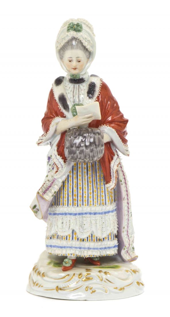 A Meissen Porcelain Figure, Height 7 3/4 inches.: A Meissen Porcelain Figure, The Female Race Goer, depicting a girl with a muff reading a letter, incised D66 and impressed 42. Height 7 3/4 inches. Property from the Estate of Edsel and Dolores Safron