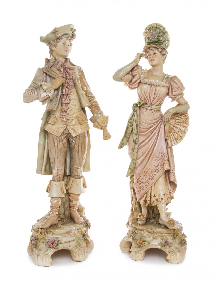 A Pair of Royal Dux Figures, Height of taller 21 1/2: A Pair of Royal Dux Figures, depicting a lady and a gentleman in Victorian costume. Height of taller 21 1/2 inches. Property from the Estate of Edsel and Dolores Safron, Town and Country, Missouri