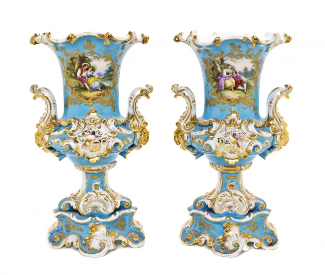 A Pair of French Porcelain Vases, Height 13 5/8 inches.: A Pair of French Porcelain Vases, each of campagna form with foliate scroll handles mounted at the shoulder, having a cartouche depicting a courting couple and floral sprays on a celeste blue ground. 