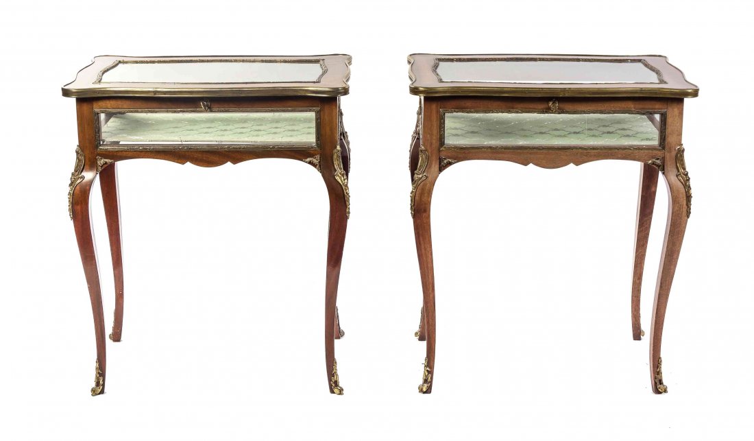 A Pair of Louis XV Style Gilt Metal Mounted Mahogany: A Pair of Louis XV Style Gilt Metal Mounted Mahogany Vitrine Tables, each having a serpentine hinged lid with a glazed top and sides, raised on cabriole legs ending in sabots. Height 29 3/4 x width 25