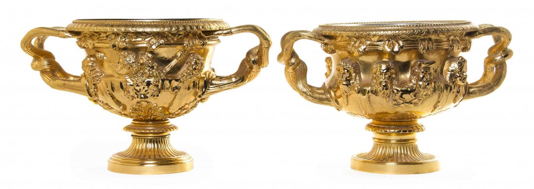 A Near Pair of Continental Gilt Bronze Urns, Height of: A Near Pair of Continental Gilt Bronze Urns, AFTER THE WARWICK VASE, each with a removable liner, one with Barbedienne foundry mark. Height of first 11 1/2 x width 20 inches. Property from the Estate 