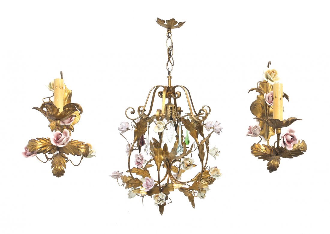 A Tole and Porcelain Lighting Suite, Height of: A Tole and Porcelain Lighting Suite, comprising a single-light chandelier and a pair of single-light sconces with applied flowers. Height of chandelier 18 inches.