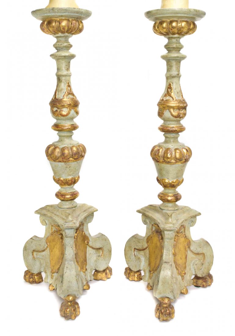 A Pair of Painted and Parcel Gilt Pricket Sticks,: A Pair of Painted and Parcel Gilt Pricket Sticks, each of baluster form with a tripartite base, mounted as lamps. Height 31 1/2 inches. Property from the Estate of David and Sally Haase, Peoria, Illin