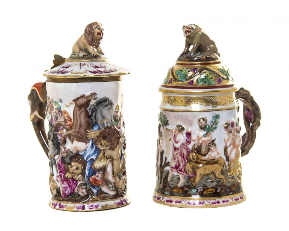 Two Capodimonte Porcelain Tankards, Height of taller 8: Two Capodimonte Porcelain Tankards, the first having an elephant form handle, a lion form finial and a depiction of a battle scene, the second having a boar form finial, a vine form handle and a depic