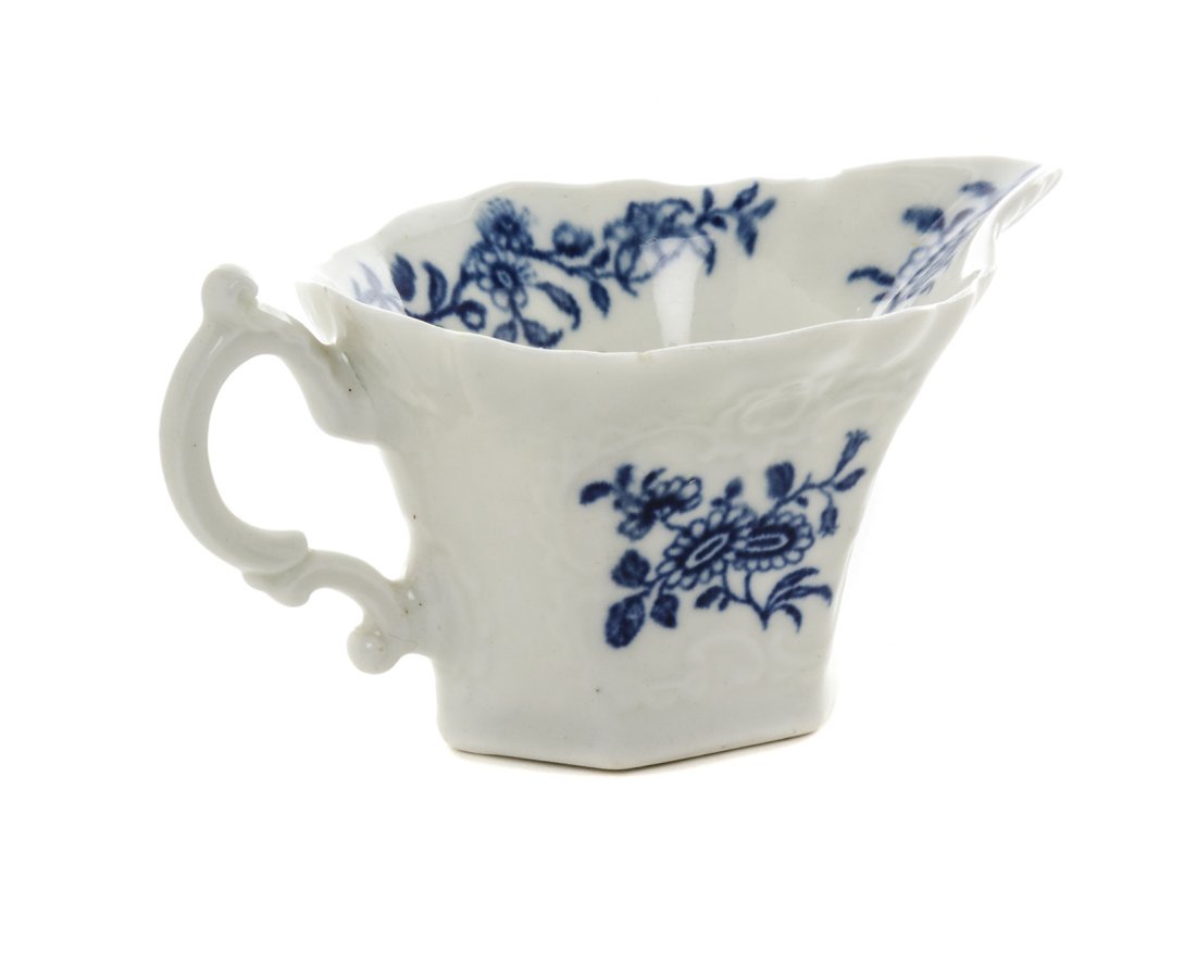 A Worcester Wigornia Porcelain Sauce Boat, Width over: A Worcester Wigornia Porcelain Sauce Boat, CIRCA 1760, bearing a hatched crescent mark to the underside. Width over handle 4 1/4 inches. Property from the Collection of Norman Lippitt, Calgary, Albert