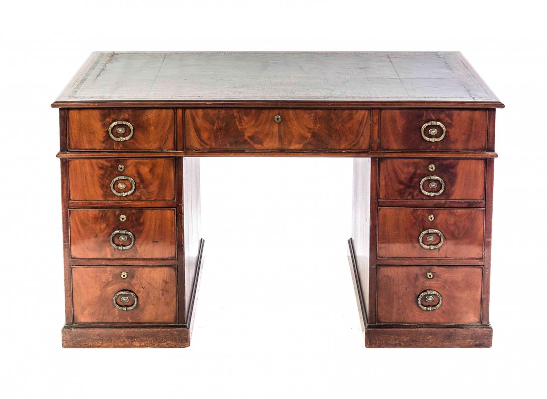 A Regency Style Mahogany Pedestal Table, Height 28 3/4: A Regency Style Mahogany Pedestal Table, 19TH/20TH CENTURY, having a rectangular tooled leather inset top above a long drawer, each pedestal set with three graduated drawers, raised on a plinth base.