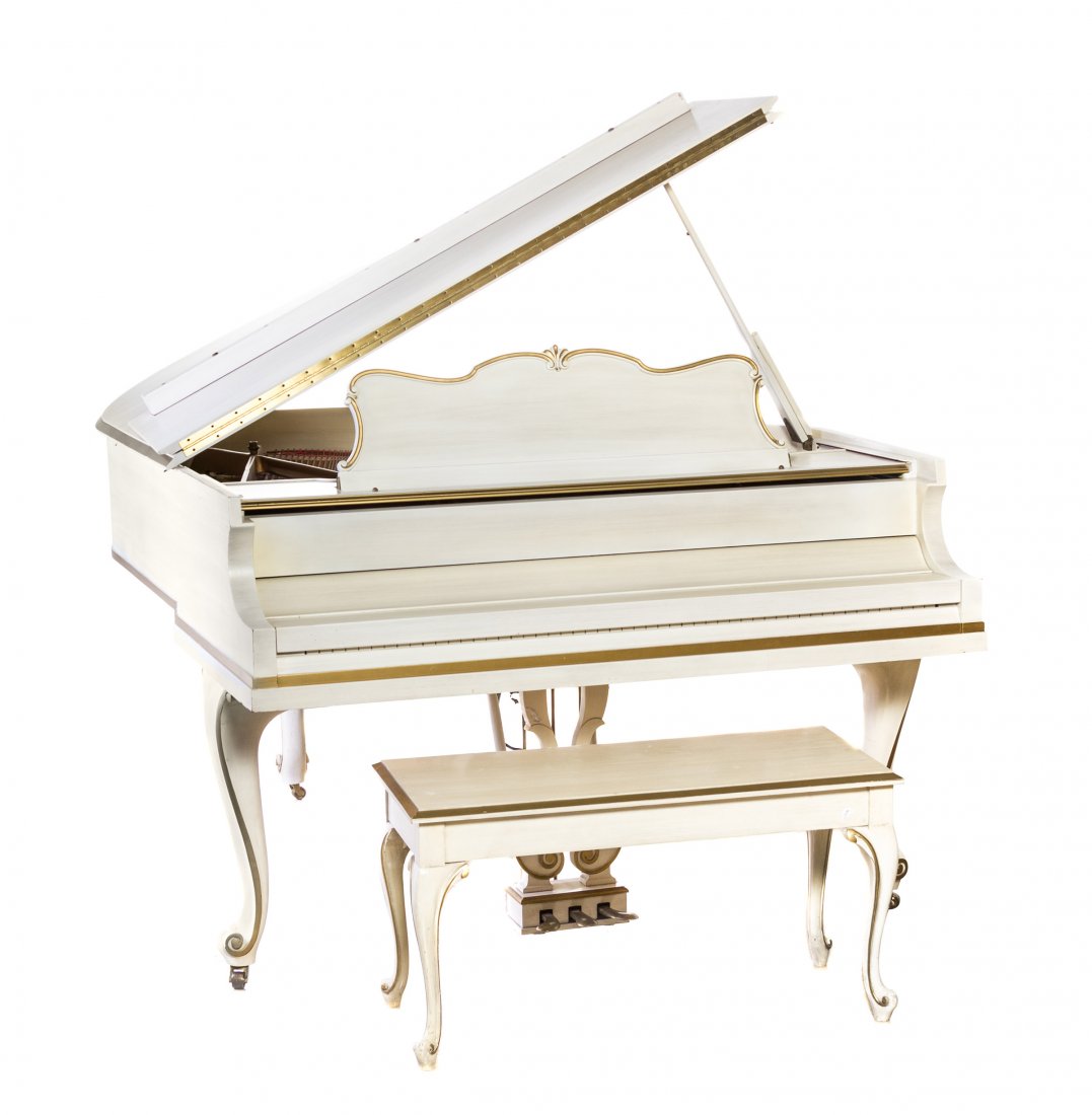 A Baldwin White Painted and Parcel Gilt Grand Piano,: A Baldwin White Painted and Parcel Gilt Grand Piano, in a Louis XV style case with cabriole legs and an associated bench. Length of case 68 x width 55 5/8 inches. Property from the Estate of David and