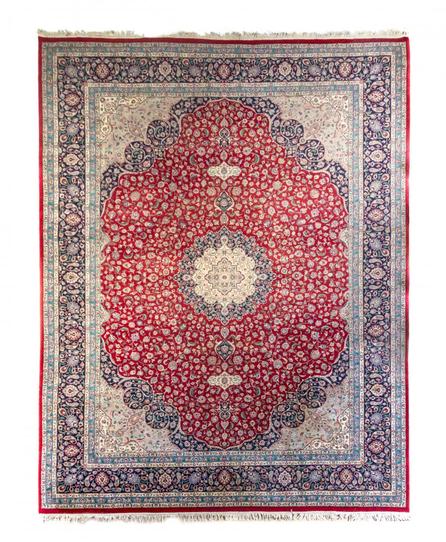 A Kirman Wool Rug, 14 feet 1 inch x 9 feet 11 inches.: A Kirman Wool Rug, SECOND HALF 20TH CENTURY, with allover foliate decoration and spandrels at the corners. 14 feet 1 inch x 9 feet 11 inches. Property from the Estate of David and Sally Haase, Peoria,