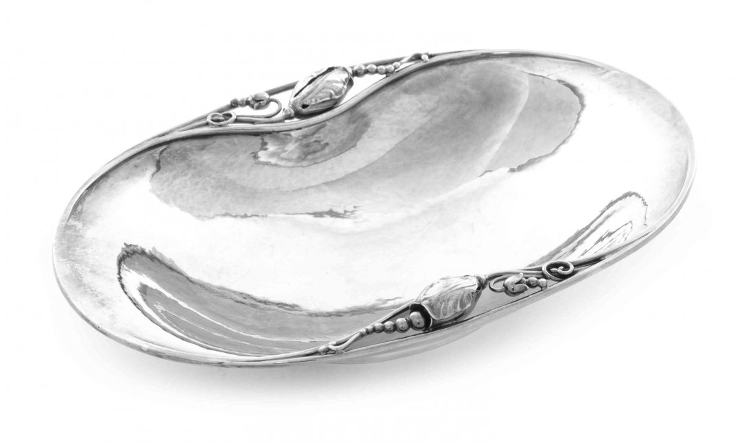 A Danish Silver Dish, No. 2B, Length 7 3/4 inches.: A Danish Silver Dish, No. 2B, Georg Jensen Silversmithy, Copenhagen, 1945-77, Blossom pattern, designed by Georg Jensen circa 1905, shaped oval, the incurved sides applied with fully modeled blossoms 