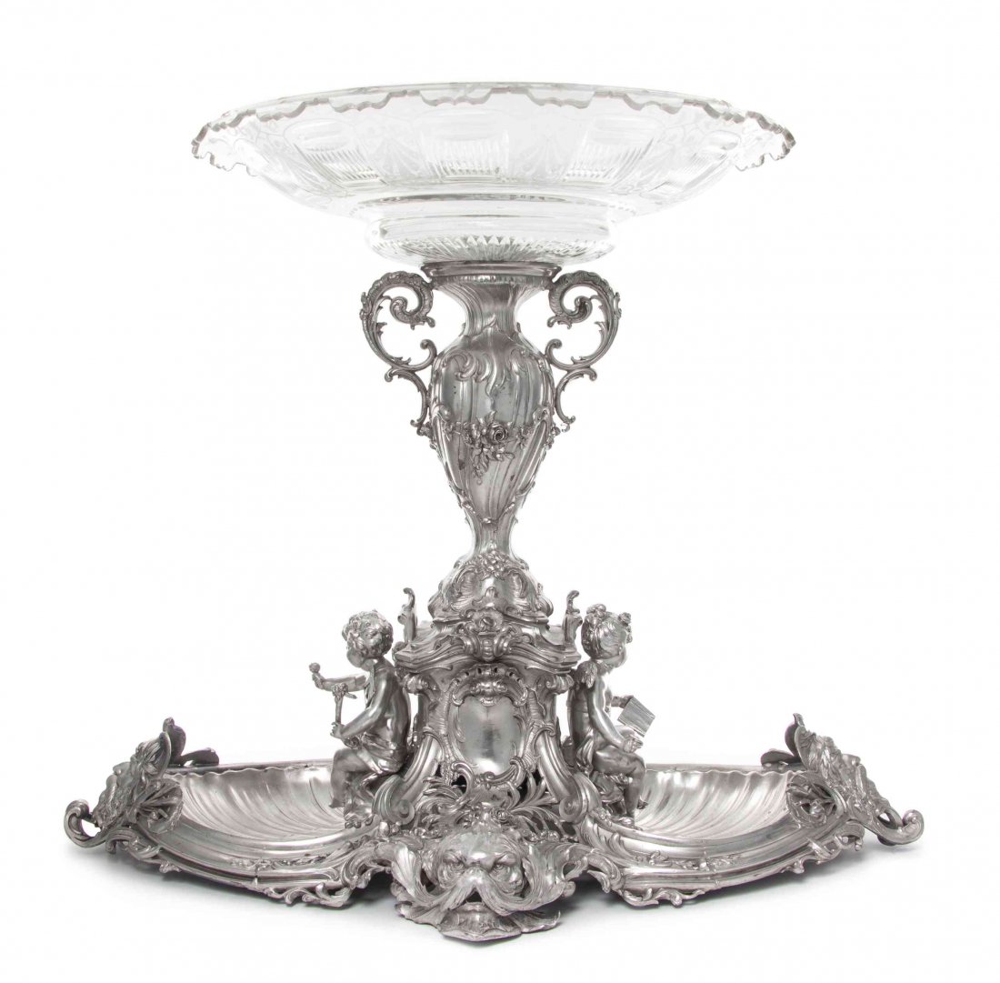 A German Silver-Plate Centerpiece, Length 24 1/2: A German Silver-Plate Centerpiece, Wurttembergische Metallwarenfabrik (WMF), Geislingen an der Steige, Early 20th Century, the base formed as two shell-form bowls applied at ends with bearded masks fl