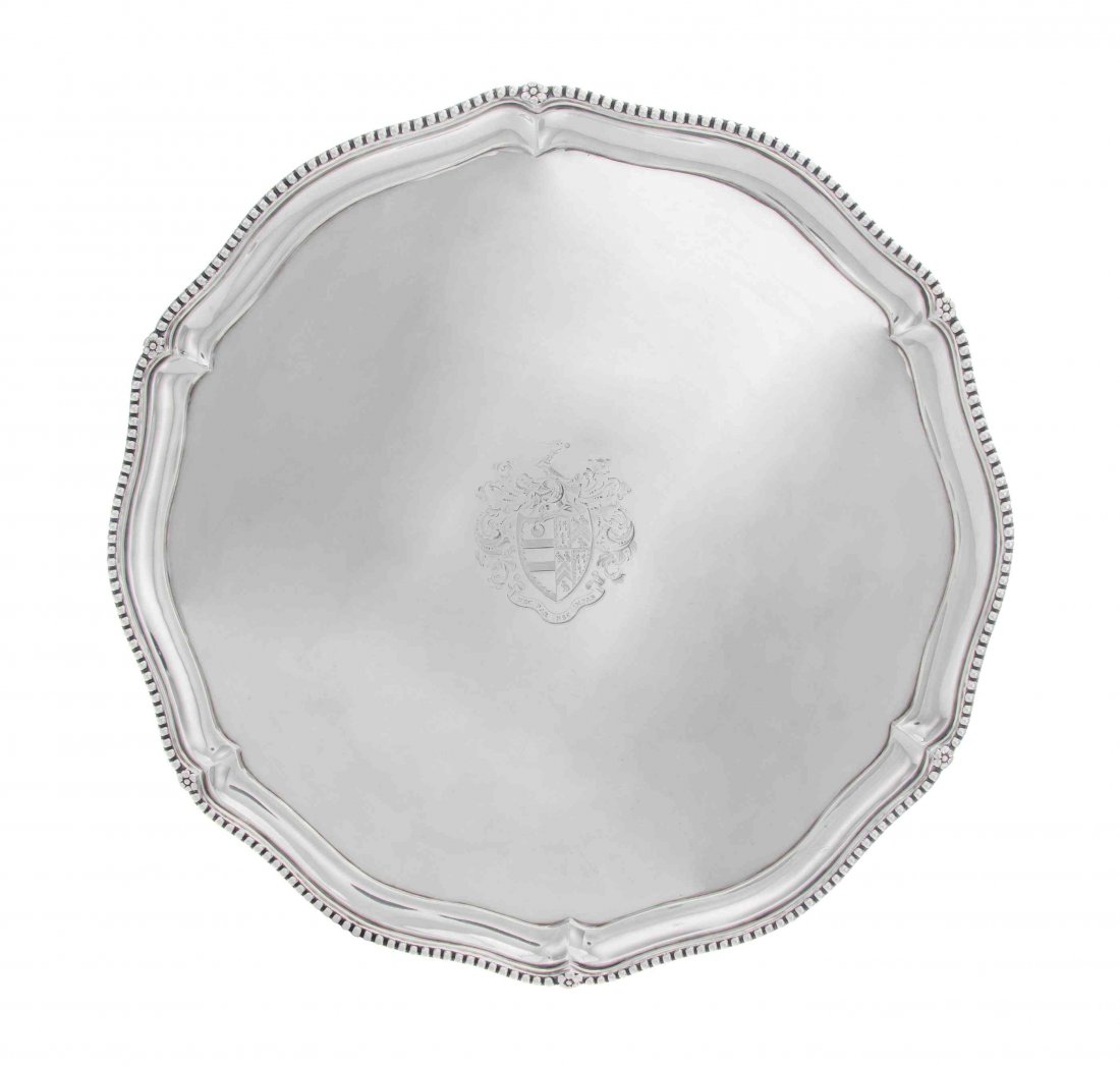 A Victorian Silver Salver, Diameter 15 inches.: A Victorian Silver Salver, Charles Stuart Harris, London, 1888, shaped circular, the applied beeded rim with flowerheads at intervals, center engraved with arms and motto under a foliate mantle, raise