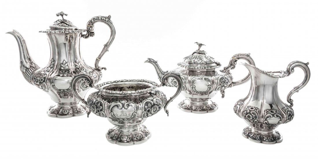 A Victorian Silver Matching Four-Piece Tea and Coffee: A Victorian Silver Matching Four-Piece Tea and Coffee Set, London, 1841-43, comprising a teapot, coffee pot, creamer, and two-handled sugar bowl, all of paneled baluster form, chased with flowers, fol
