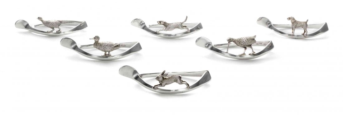 A Set of Six English Silver Napkin Rings, Length 2 3/4: A Set of Six English Silver Napkin Rings, G & C Hodgettes, Birmingham, 1914, of wishbone form, applied with game birds, a hare and two terriers, in fitted box, fully marked. Length 2 3/4 inches. Prope