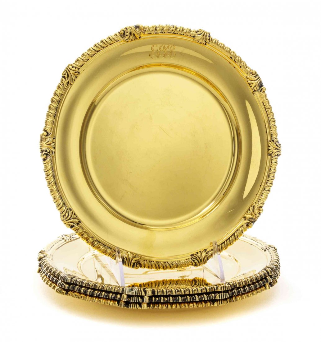 A Set of Four American Silver-Gilt Dinner Plates,: A Set of Four American Silver-Gilt Dinner Plates, Tiffany & Co., New York, NY, Mid 20th Century, circular, the gadrooned rims with leaf-tips at intervals, the borders engraved with monogram GGB, marke