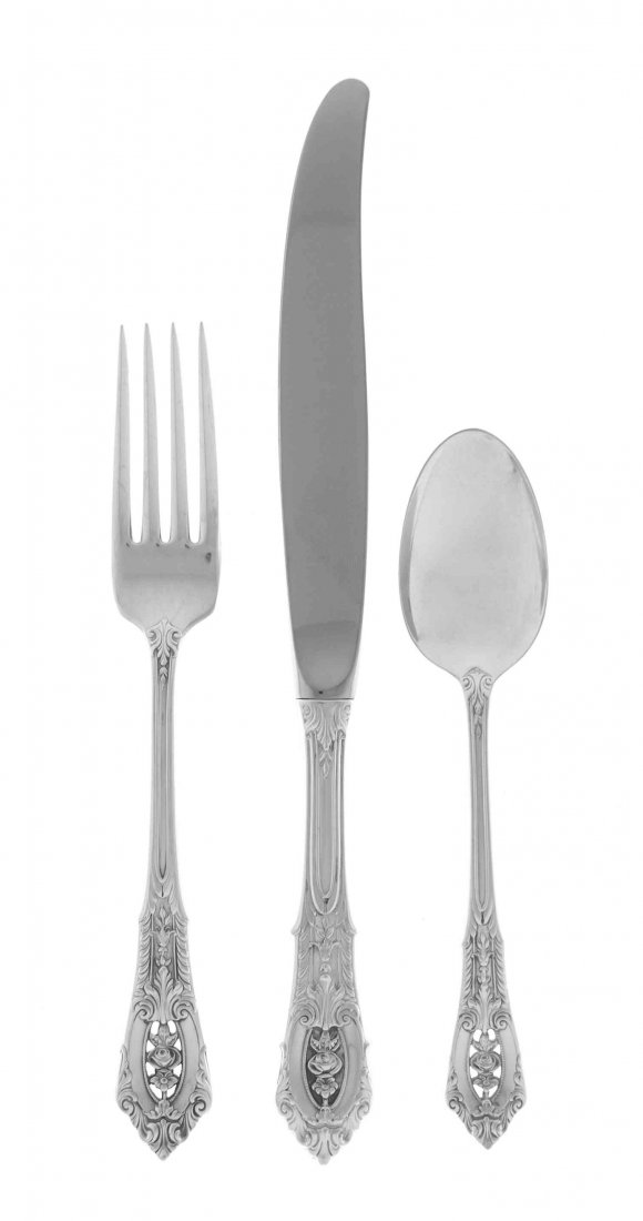 An American Silver Flatware Service,: An American Silver Flatware Service, Wallace Silversmiths, Wallingford, CT, Circa 1935, Rose Point pattern, comprising 12 dinner knives 12 dinner forks 12 butter spreaders 12 salad forks 12 oyster for
