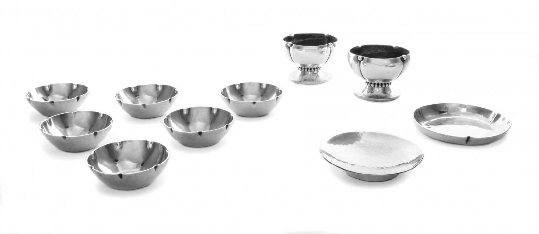Eight American Silver Salts, Diameter 2 inches.: Eight American Silver Salts, Joel F. Hewes, Chicago, IL, 1910-20 / The Randahl Shop, Chicago, IL, Circa 1920, comprising a set of six salts and a pair of footed salts, all with spot-hammered surfaces 