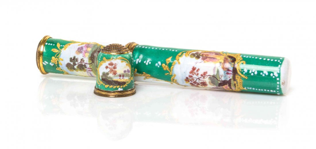 A South Staffordshire Enameled Needle Case and Thimble,: A South Staffordshire Enameled Needle Case and Thimble, 18TH CENTURY, worked in polychrome enamels on a green ground to show pastoral landscape cartouches and the inscription "Sincere en amitie." Leng