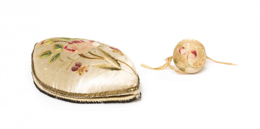 A Continental Embroidered Silk Pin Cushion, Length 6: A Continental Embroidered Silk Pin Cushion, LATE 18TH / EARLY 19TH CENTURY, of oblong form, embroidered to show floral sprays, opening to a vacant thimble cavity and needle storage, together with a sp