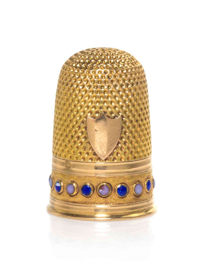 A French Gold and Hardstone-Mounted Thimble, Height 7/8: A French Gold and Hardstone-Mounted Thimble, SECOND HALF 19TH CENTURY, the thimble's lower body with a band of alternating blue and pink cabochon hardstones against a matted ground, also applied with 