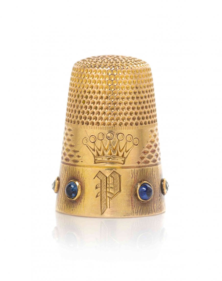 A German 14-Karat Gold, Diamond and Sapphire-Mounted: A German 14-Karat Gold, Diamond and Sapphire-Mounted Thimble, 19TH CENTURY, the sides with a band of bright-cut scalloped indentations and engraved with a countess's coronet over initial P, the lower 