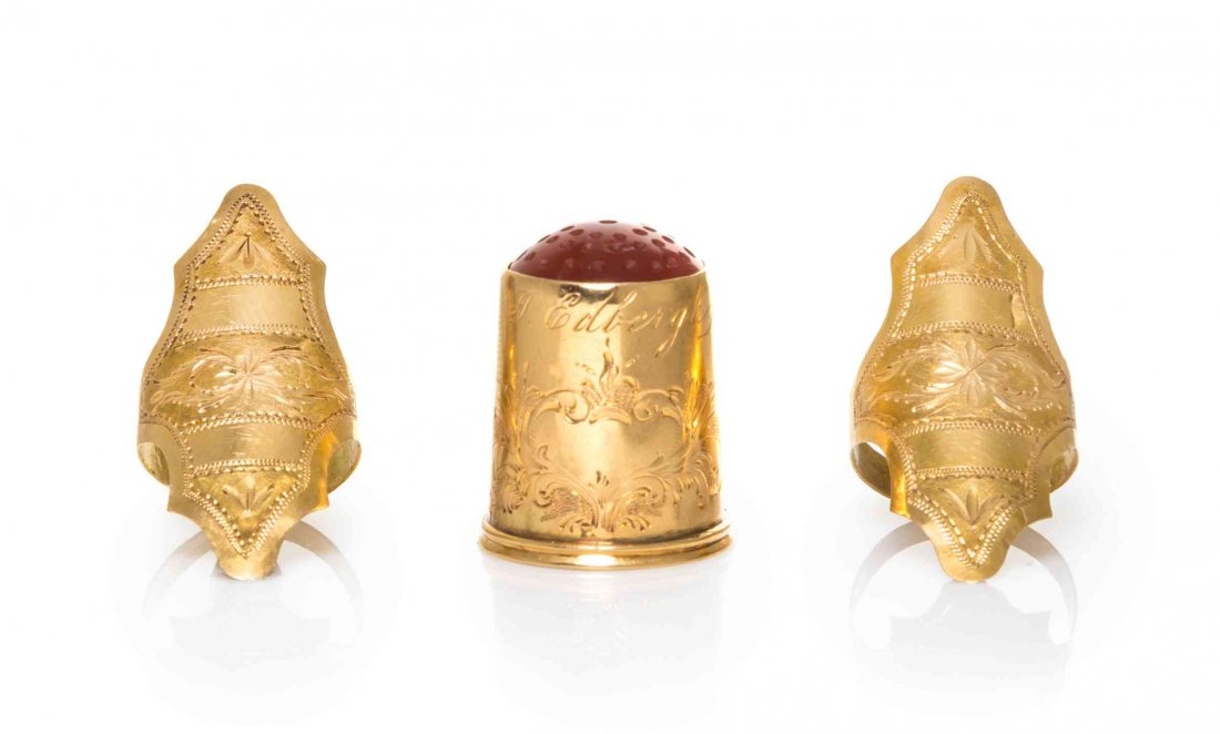 A Swedish 18-Karat Gold Tatting Set, Height of thimble: A Swedish 18-Karat Gold Tatting Set, 1832, 1860, comprising a pair of finger guards and an associated thimble, the cartouche form guards engraved with horizontal panels of foliage, the thimble engrave
