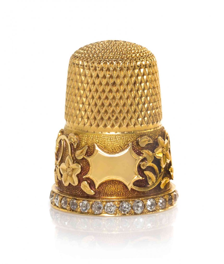 A Gold and Diamond-Mounted Thimble, Height 7/8 inch.: A Gold and Diamond-Mounted Thimble, POSSIBLY AMERICAN, LATE 19TH CENTURY, the lower body applied with a band of running flowers and foliage centered by a vacant cartouche, all on a matted ground, the 