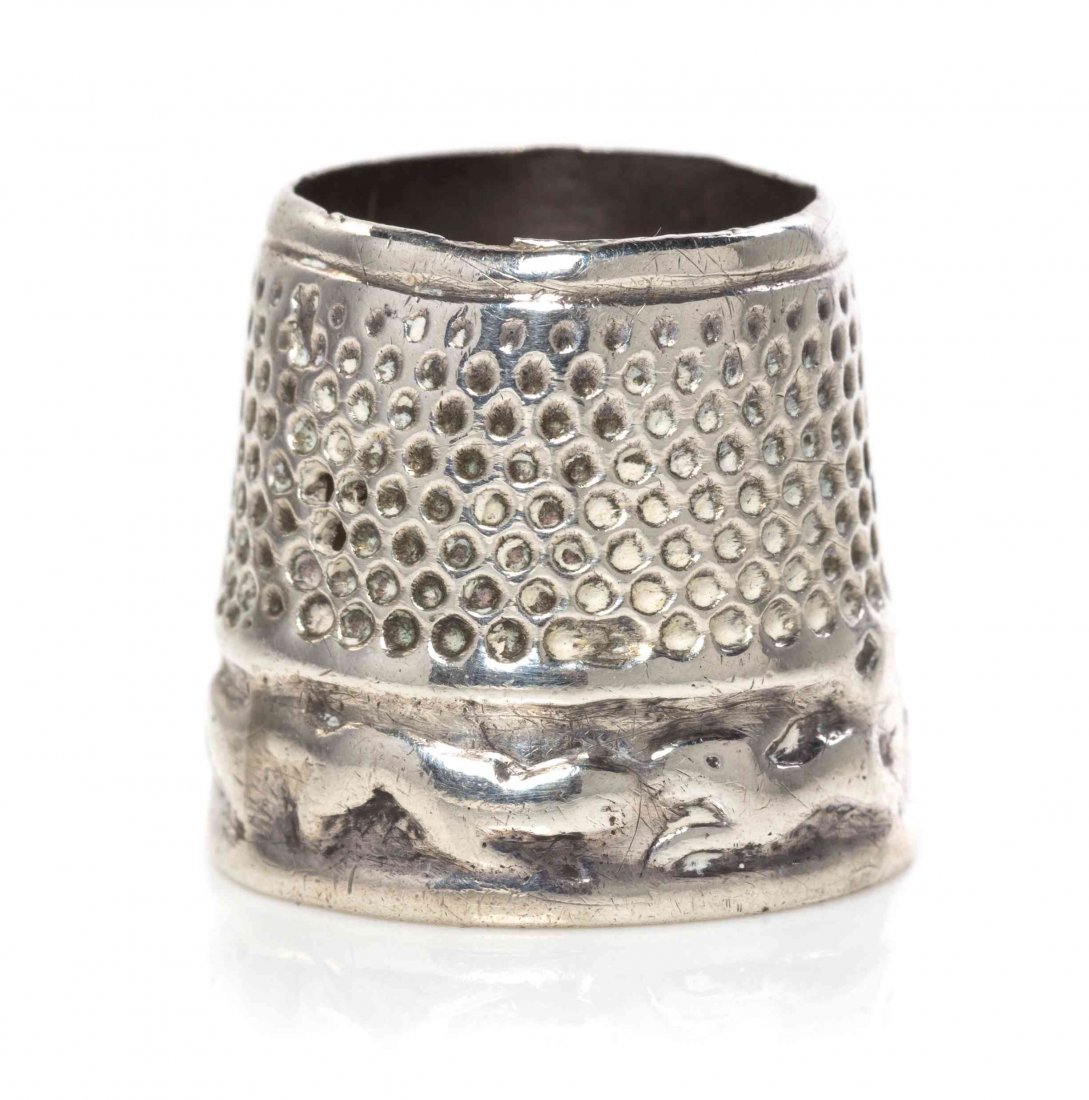 A Dutch Silver Thimble, Height 3/4 inch.: A Dutch Silver Thimble, 18TH CENTURY, the lower body decorated with band of hounds chasing hares, apparently unmarked. Height 3/4 inch.