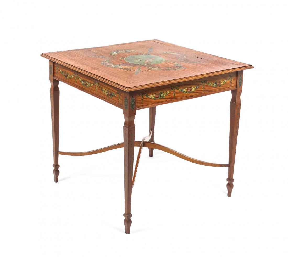 An Edwardian Adam Style Painted Satinwood Center Table,: An Edwardian Adam Style Painted Satinwood Center Table, having a square top painted with floral swags and a central roundel depicting musical cherubs, raised on square tapering legs joined by an X-for