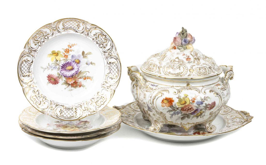 A Continental Parcel Gilt Soup Tureen, Platter and: A Continental Parcel Gilt Soup Tureen, Platter and Plates, KPM, comprising a lidded soup tureen, together with platter and twelve matching soup plates, having parcel gilt and floral decoration. Length
