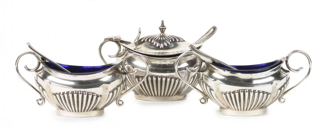 A Pair of Edwardian Silver Salts, Walker & Hall,: A Pair of Edwardian Silver Salts, Walker & Hall, Sheffield, 1901, of oval form with gadrooned sides and removable blue glass liners, together with matching mustard pot and three spoons; 4 ozt weighabl