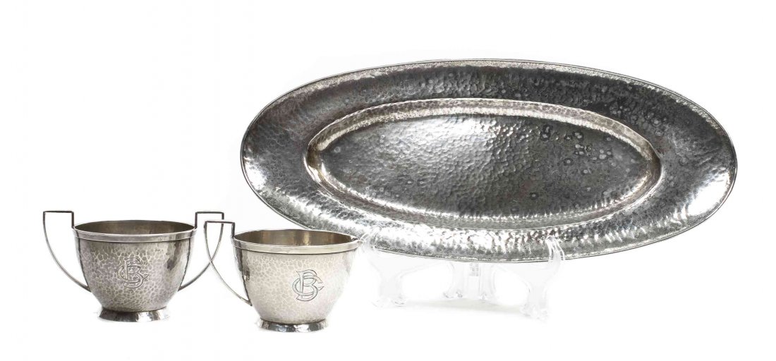 An American Arts and Crafts Hammered Silver Creamer and: An American Arts and Crafts Hammered Silver Creamer and Sugar, Marshall Field & Co., Chicago, each monogrammed and marked MF&CO Colonial Sterling together with an associated hammered silver tray marke