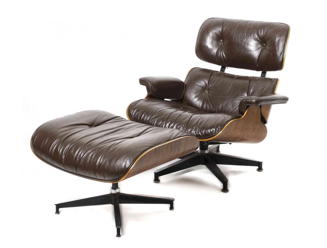 A Charles and Ray Eames Rosewood 670 Lounge Chair and: A Charles and Ray Eames Rosewood 670 Lounge Chair and 671 Ottoman, for Herman Miller, having a tufted upholstered back, arms and seat, raised on a five part base, the ottoman upholstered, bearing the 