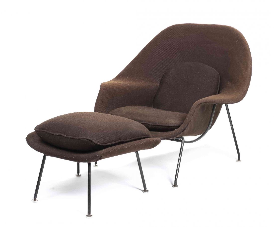 An Eero Saarinen Womb Chair and Ottoman, (Finnish,: An Eero Saarinen Womb Chair and Ottoman, (Finnish, 1910-1961) for Knoll, the chair having an upholstered back arms and seat, raised on tubular legs, with an upholstered ottoman, unmarked. Height of ch