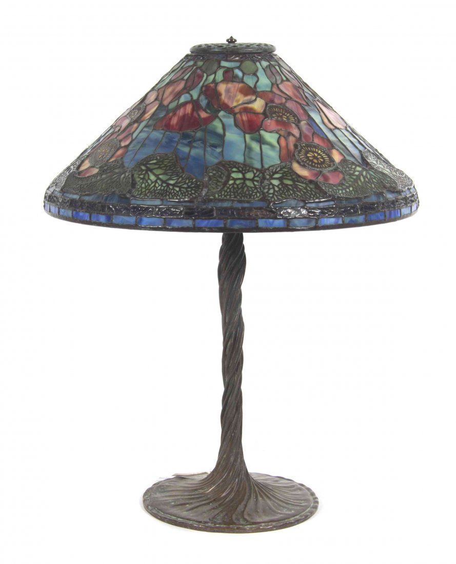 An American Leaded Glass Table Lamp, Height 25 1/4 x: An American Leaded Glass Table Lamp, having a conical shade decorated with poppies raised on a patinated vine twist standard ending in a circular base, the shade bearing a spurious Tiffany Studios New