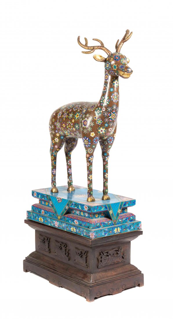 A Chinese Cloisonne Enamel Model of a Spotted Deer,: A Chinese Cloisonne Enamel Model of a Spotted Deer, shown in a forward facing standing pose, having gilt antlers and highlights throughout, the main body having decoration of polychrome medallions set