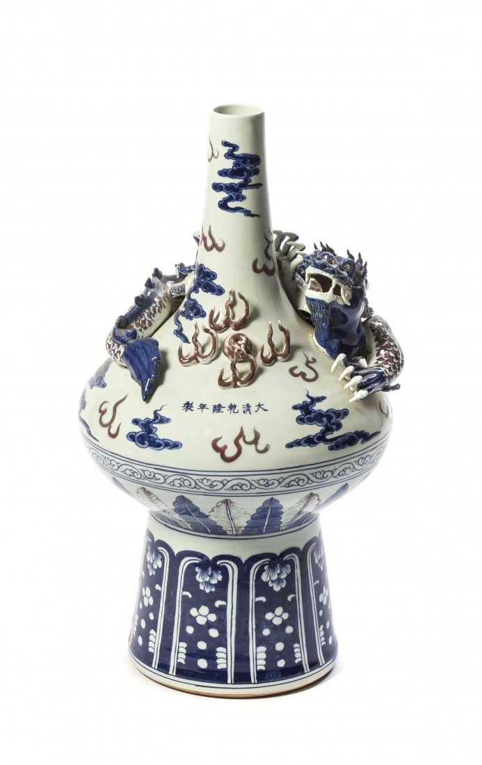 A Chinese Porcelain Vessel, Height 26 inches.: A Chinese Porcelain Vessel, having underglazed blue and iron-red decoration, with applied dragon and flames around the base of the neck and apocryphal six character Qianlong underglaze mark at the bul