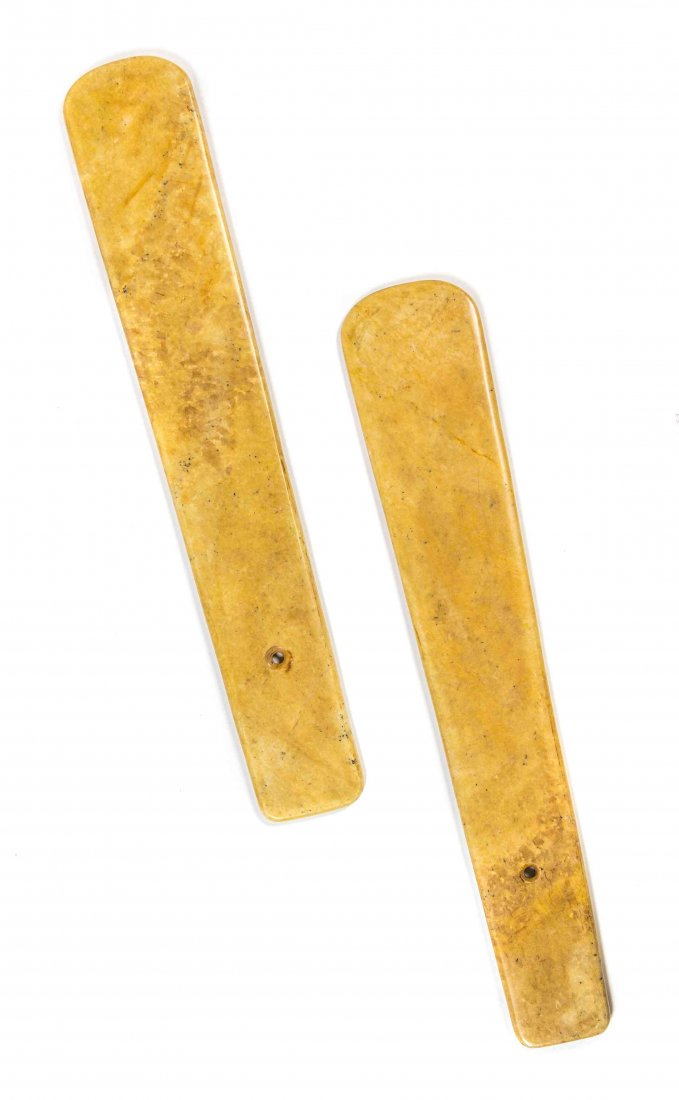 A Pair of Chinese Stone Tablets, Length 22 1/4 inches.: A Pair of Chinese Stone Tablets, each of a variegated tan hue and of tapering blade form with a circular piercing. Length 22 1/4 inches. Condition: In overall good condition, natural fissures to the s