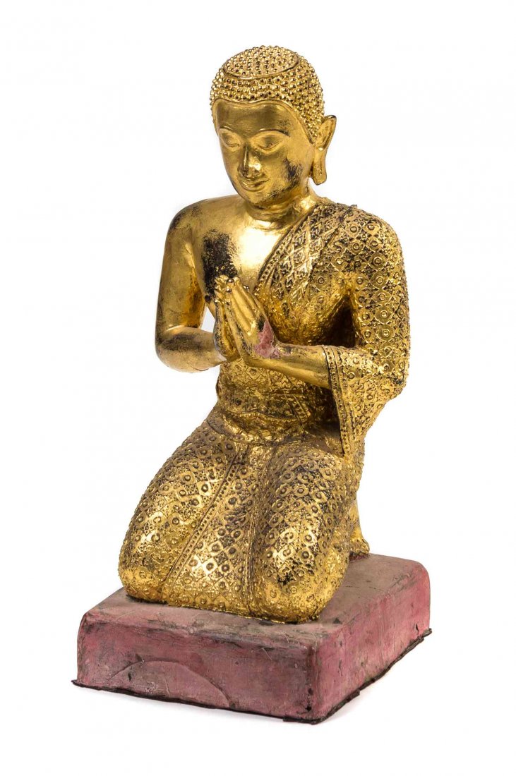 A Thai Gilt Painted Bronze Figure of a Buddhist: A Thai Gilt Painted Bronze Figure of a Buddhist Disciple, the figure depicted kneeling, with patterned robes and raised snail knots to the hair, raised on a squared base. Height overall 21 1/2 inches.