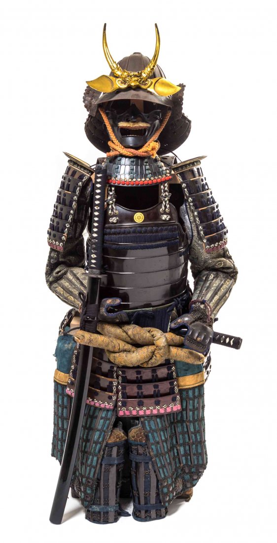 A Japanese Suit of Samurai Armor, Height 20 1/2 x width: A Japanese Suit of Samurai Armor, lacquered, together with carrying case. Height 20 1/2 x width 15 3/4 x depth 14 3/4 inches.
