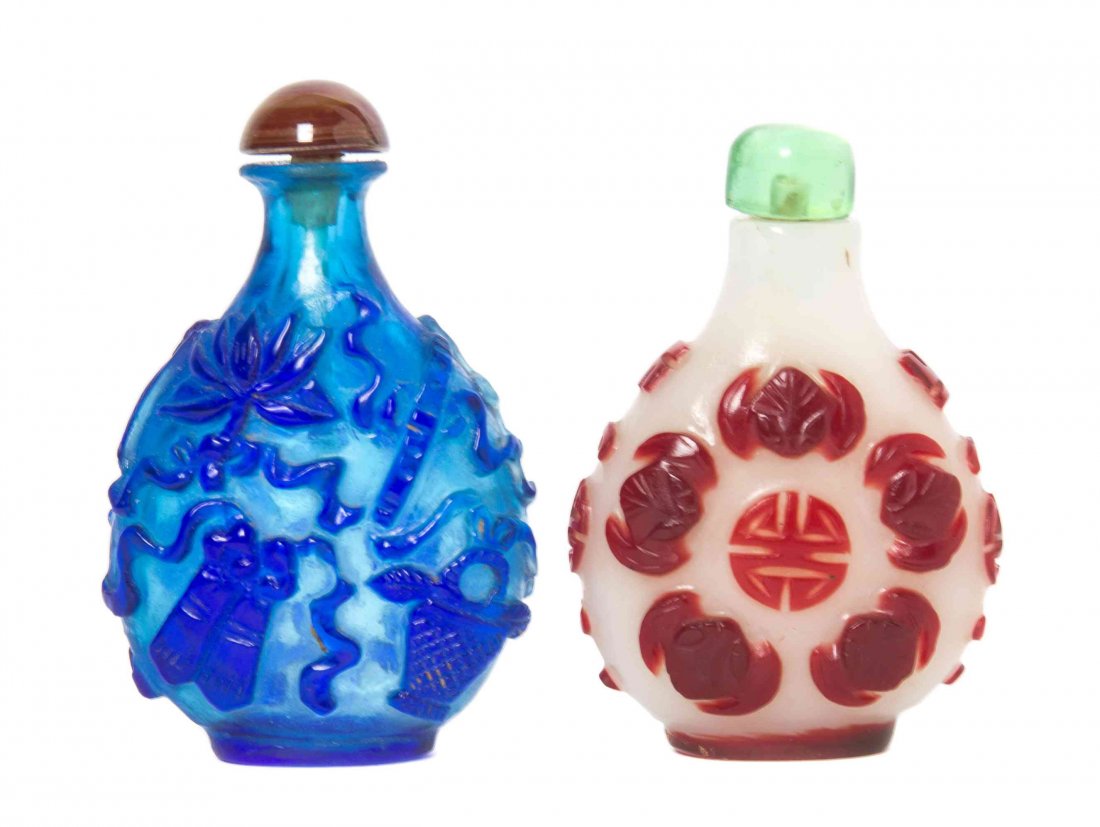 Two Peking Glass Snuff Bottles, Height of taller 2 1/2: Two Peking Glass Snuff Bottles, each of compressed, rounded form, one with opaque cobalt blue overlay on a transparent blue ground and depicting the eight Daoist emblems, the other of red overlay on a