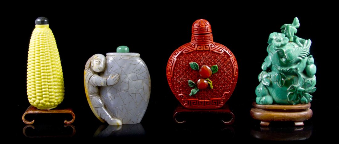 A Group of Four Snuff Bottles, Height of tallest: A Group of Four Snuff Bottles, comprising a carved malachite example, a cinnabar lacquer style example, a molded porcelain example in the form of an ear of corn and one hardstone example. Height of ta
