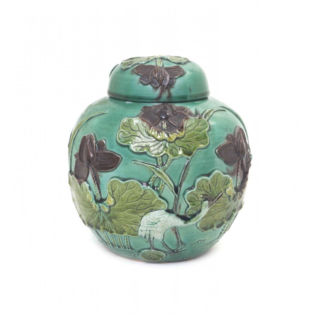 A Porcelain Jar and Cover, Height 5 inches.: A Porcelain Jar and Cover, having modeled lotus and crane decoration. Height 5 inches.