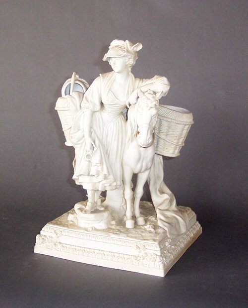 BISQUE PORCELAIN FIGURAL GROUP OF A MILKM